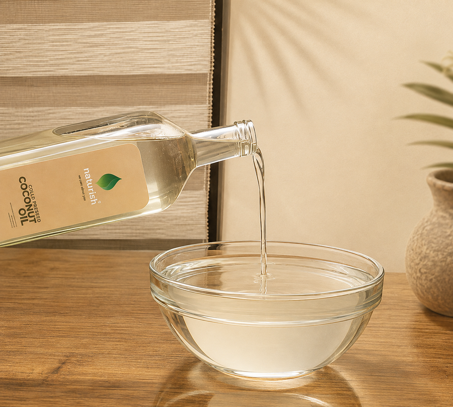 Cold pressed coconut oil pouring