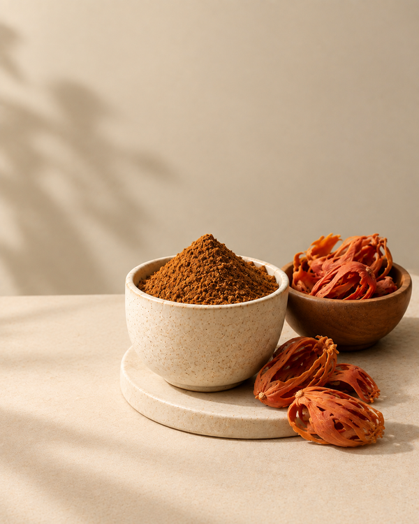Freshly ground garam masala with whole spices alongside