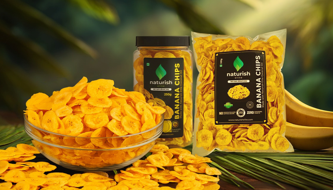Naturish Elite jaggery-coated banana chips displayed in a glass bowl, stand-up pouch and plastic jar against a warm festive background.
